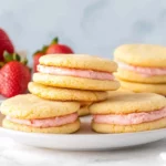 Lemon Sandwich Cookies with Strawberry Frosting