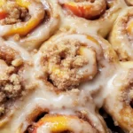Peach Cobbler Cinnamon Rolls with Crumb Topping